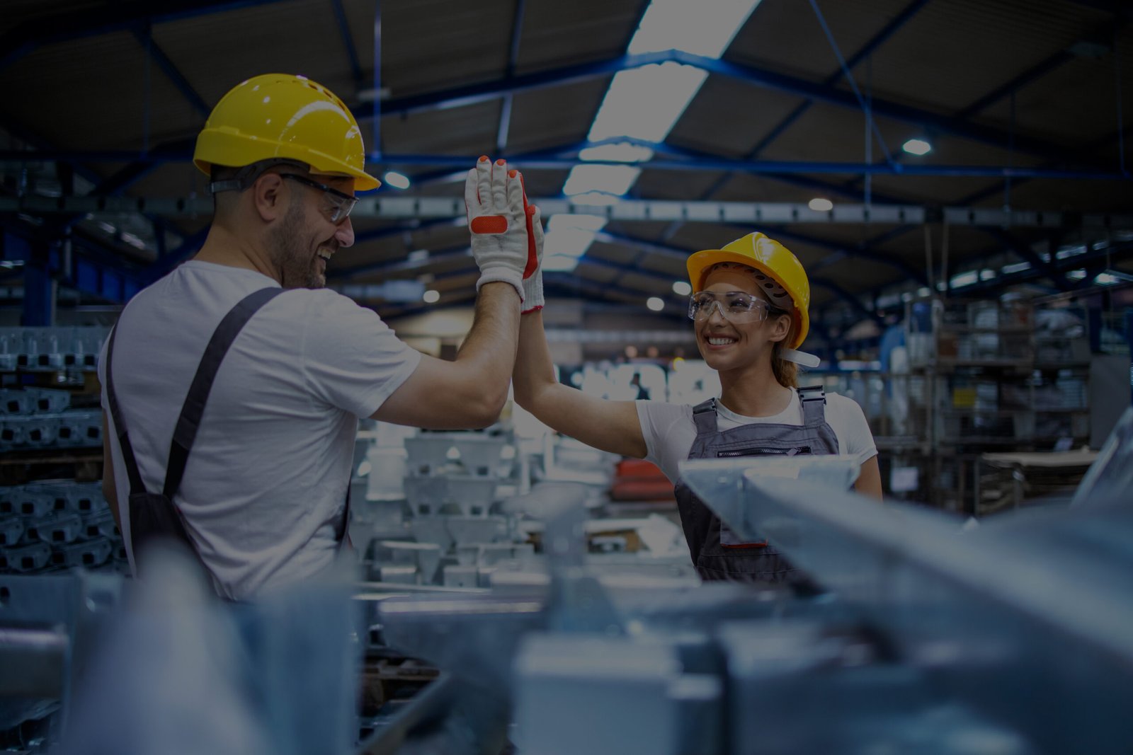 factory-workers-greeting-each-other-successful-teamwork
